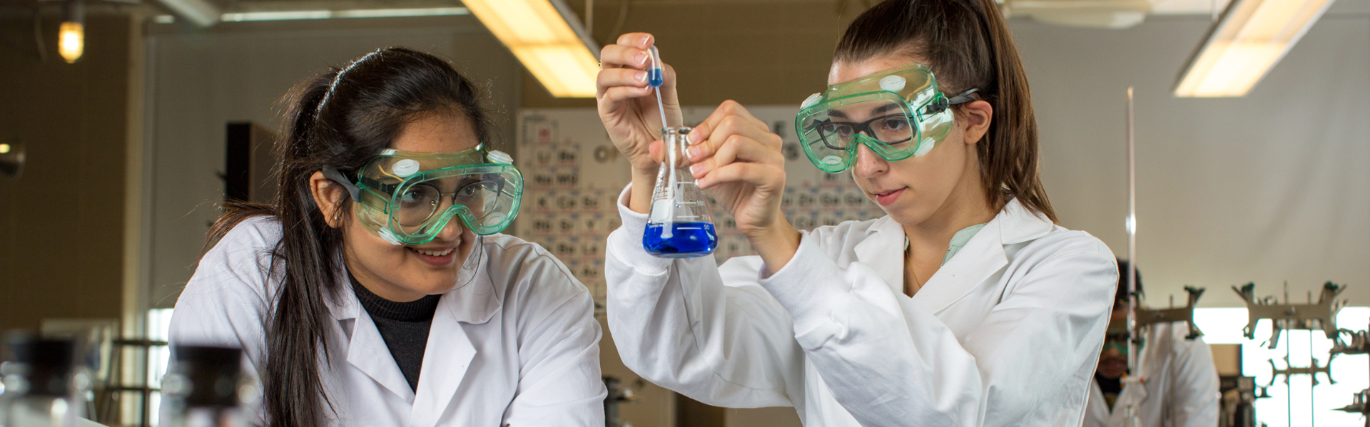 Two woman working in a chemistry lab